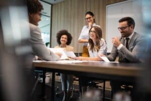 Business colleagues in conference meeting room during presentation