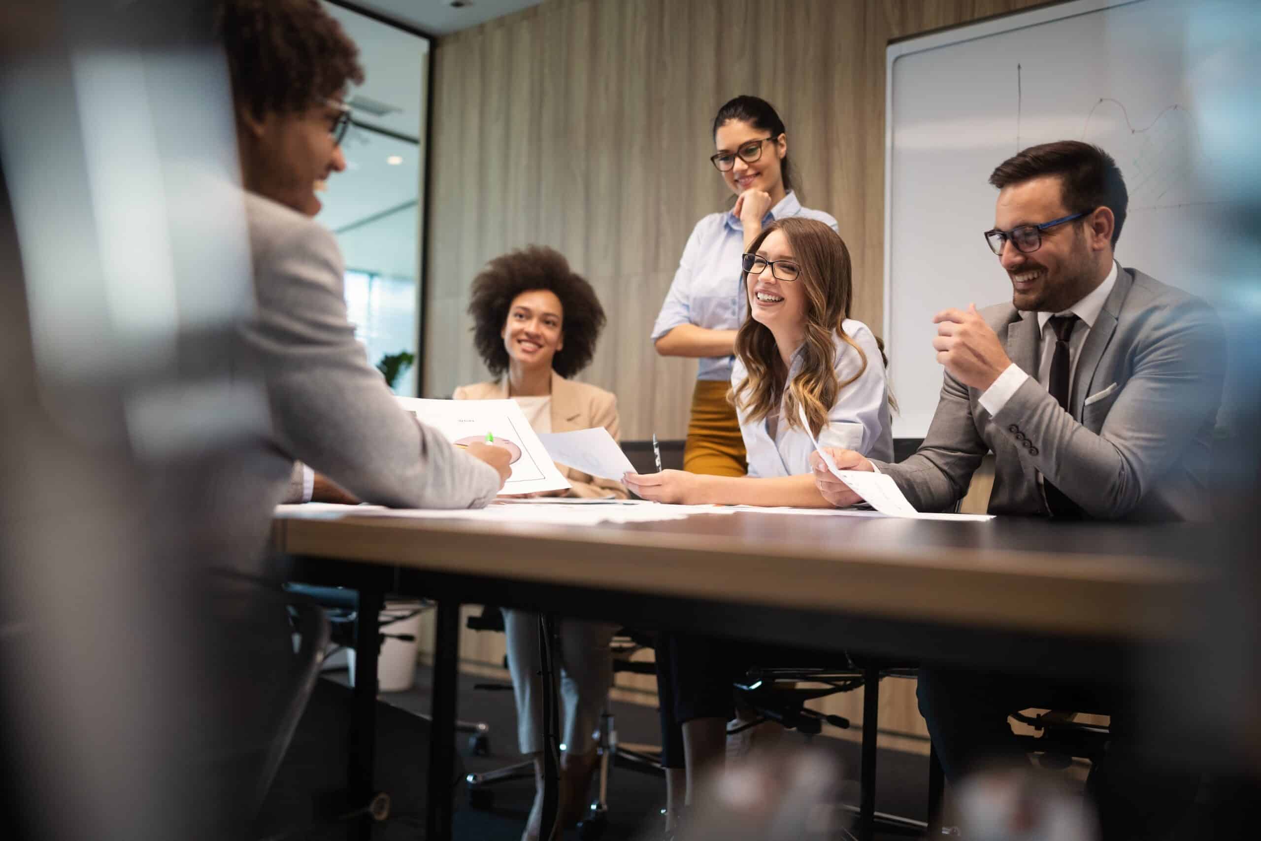 Business colleagues in conference meeting room during presentation