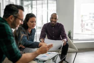 Casual meeting of diverse business team discuss direct hire
